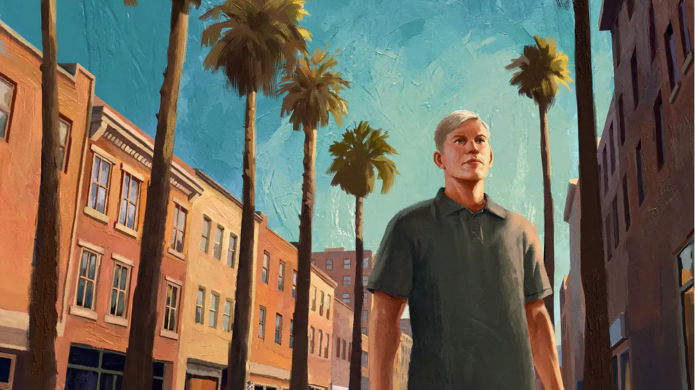 Man wearing a polo shirt walking down a city street