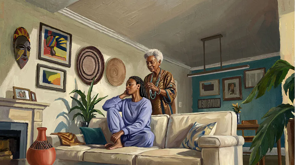 Older mother standing behind her adult daughter while styling her hair