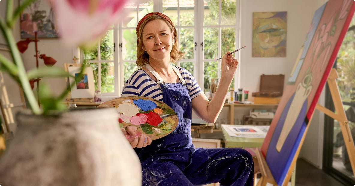 EGPA patient Meredith painting in her studio EGPA patient Meredith painting in her studio
