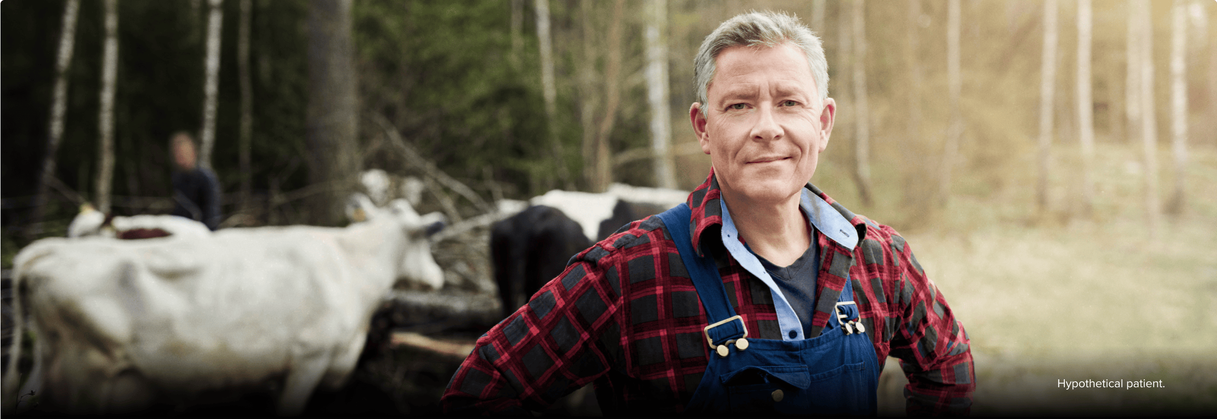 Nasal polyps patient Frank standing in a wooded area with cows Nasal polyps patient Frank standing in a wooded area with cows