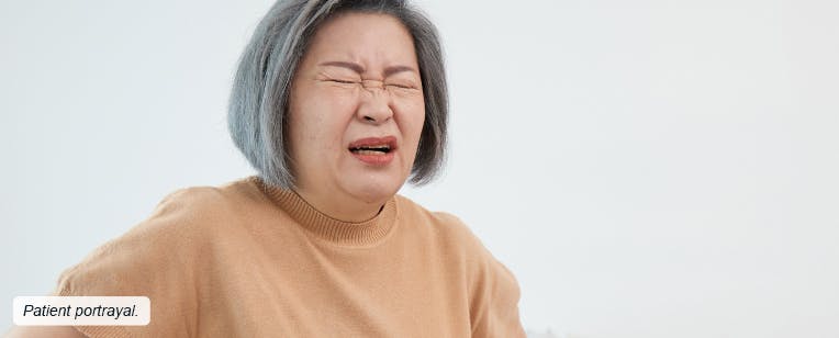 A woman in pain from postherpetic neuralgia