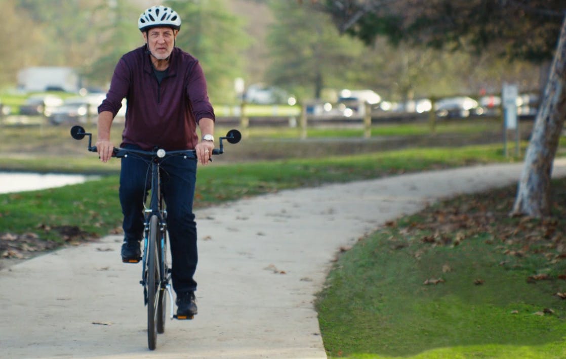Barry, a patient living with COPD, riding his bicycle
