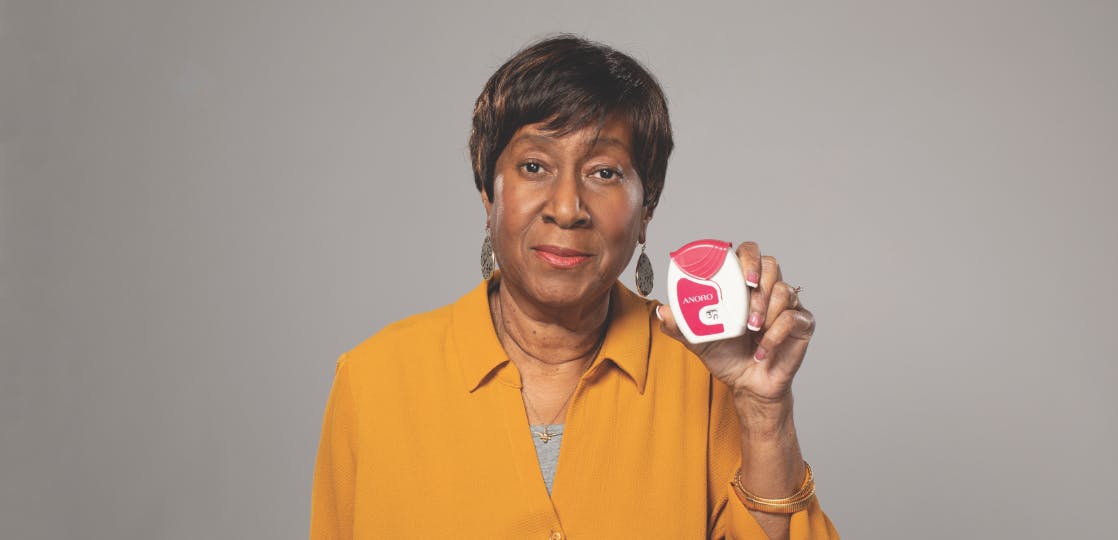 Woman holding ANORO ELLIPTA Inhaler