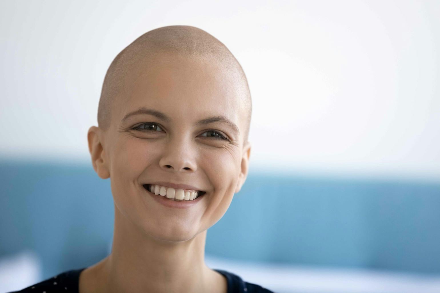 Happy young woman suffer from oncology look in distance dreaming Happy young woman suffer from oncology look in distance dreaming