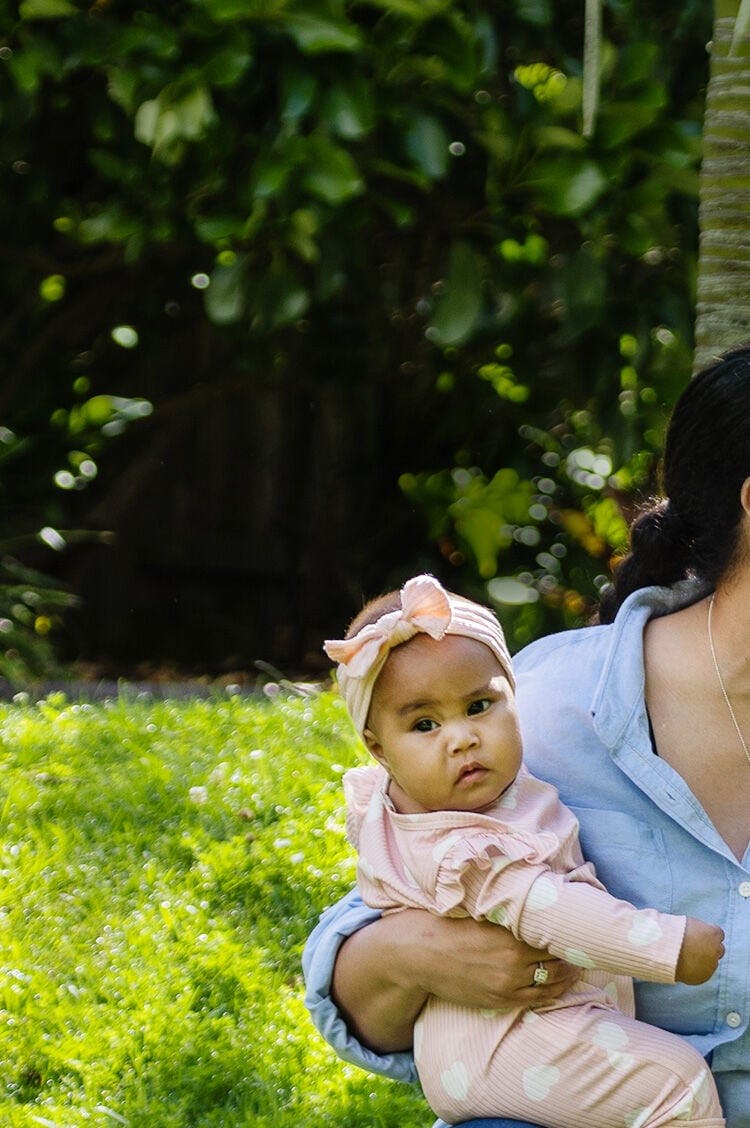 Baby on her mother's arm