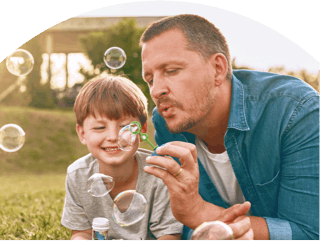 Image: Parent and Child Blowing Bubbles