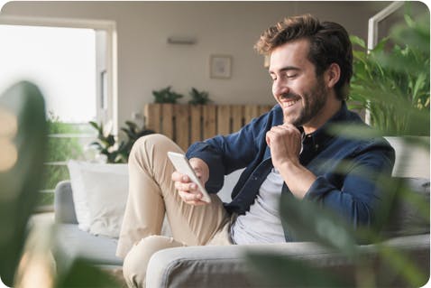 Image: Person Smiling at Phone Image: Person Smiling at Phone