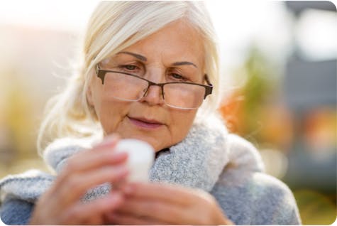 Image: Woman Taking Asthma Medication