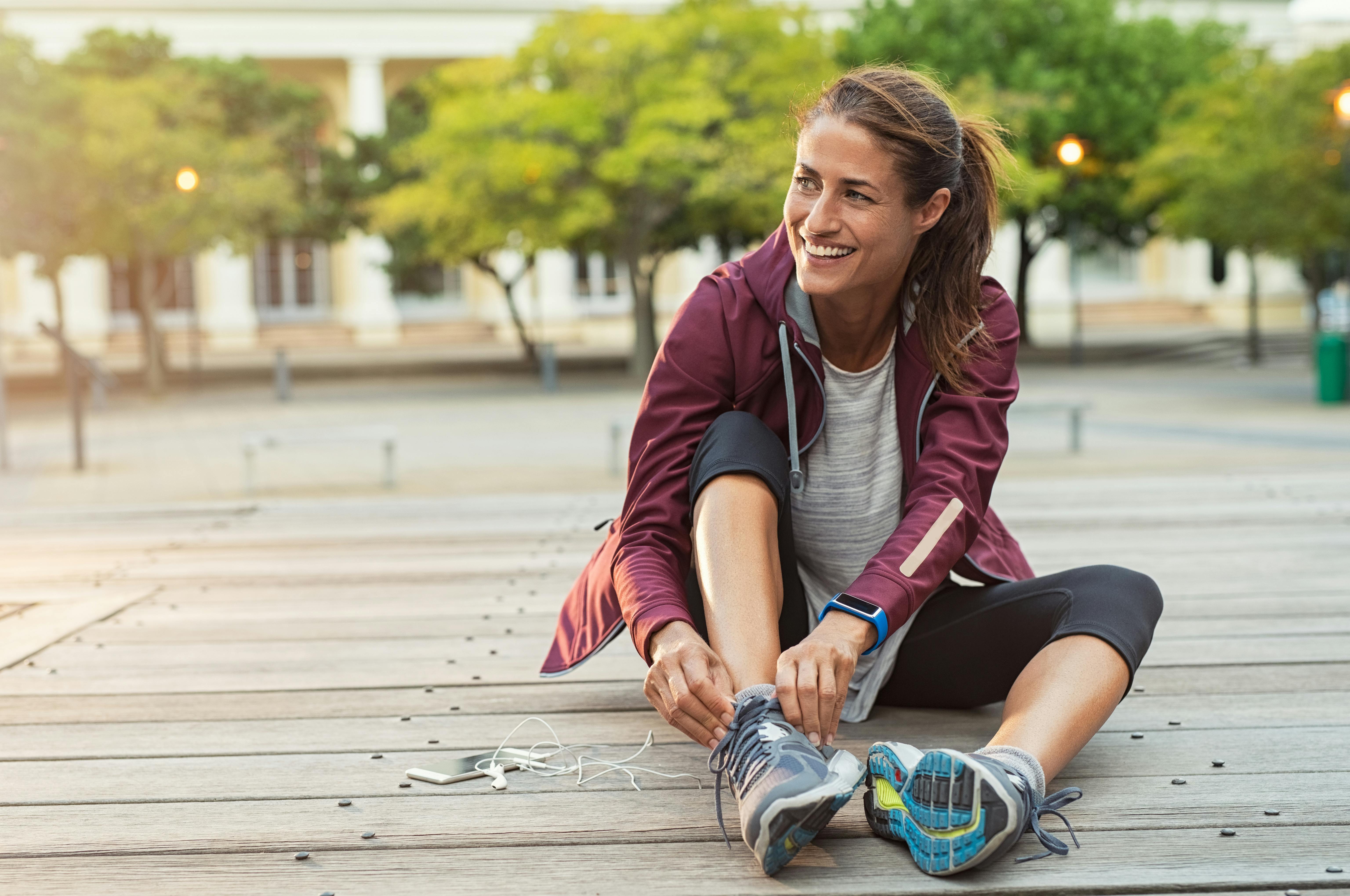 woman-putting-sneakers-on