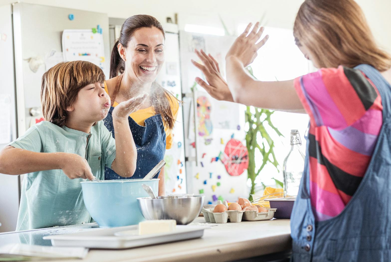 Mom and kids cooking