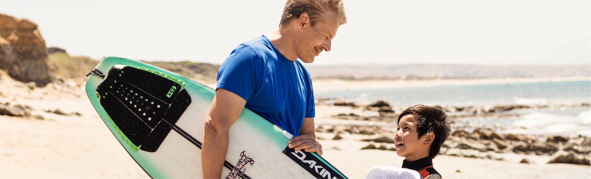 boy and man surfing