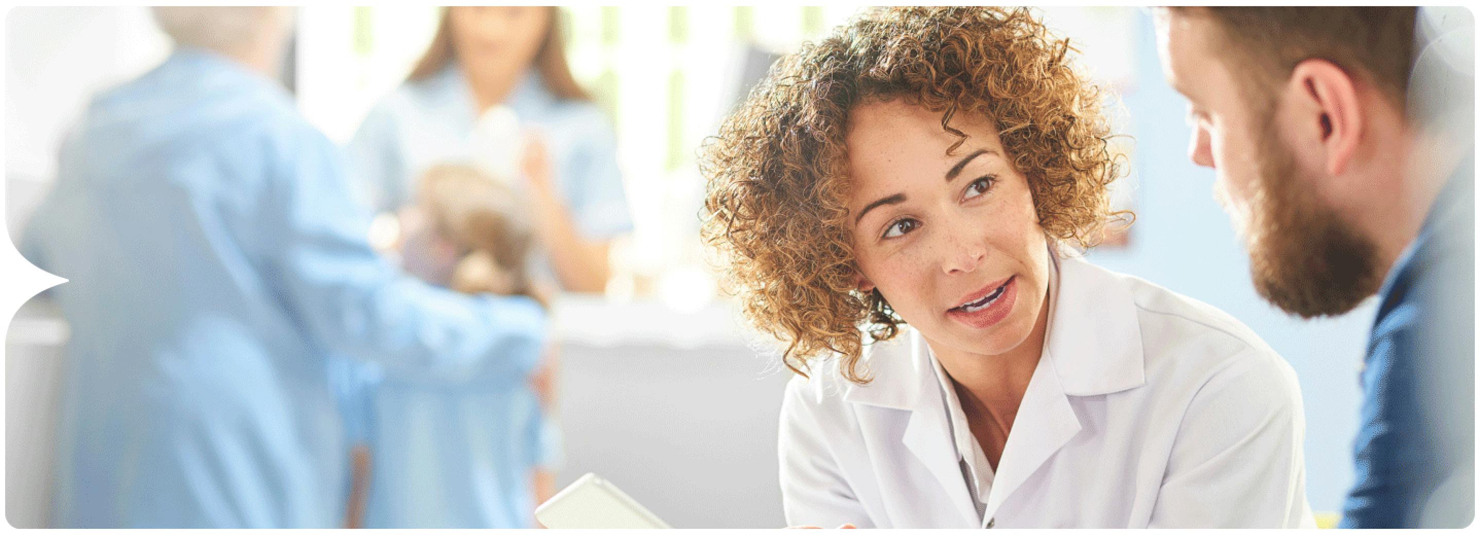 Image: Pharmacist talking to patient