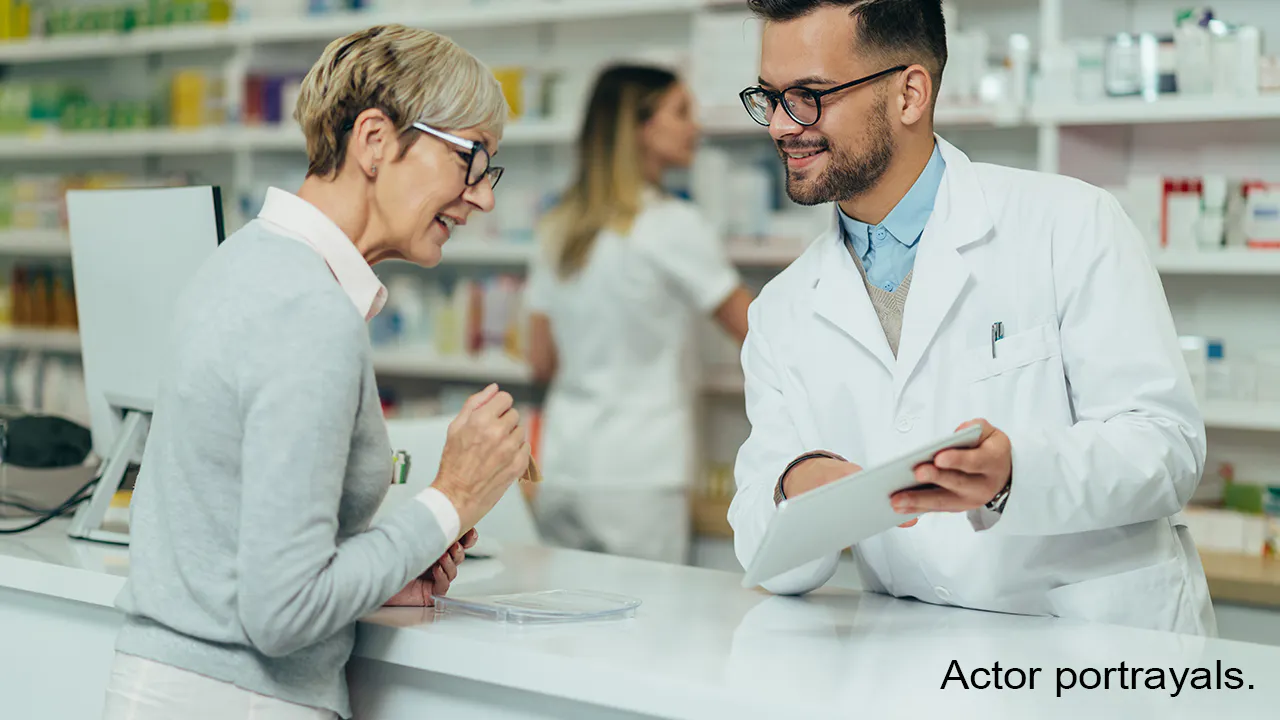 Image: pharmacist showing patient information