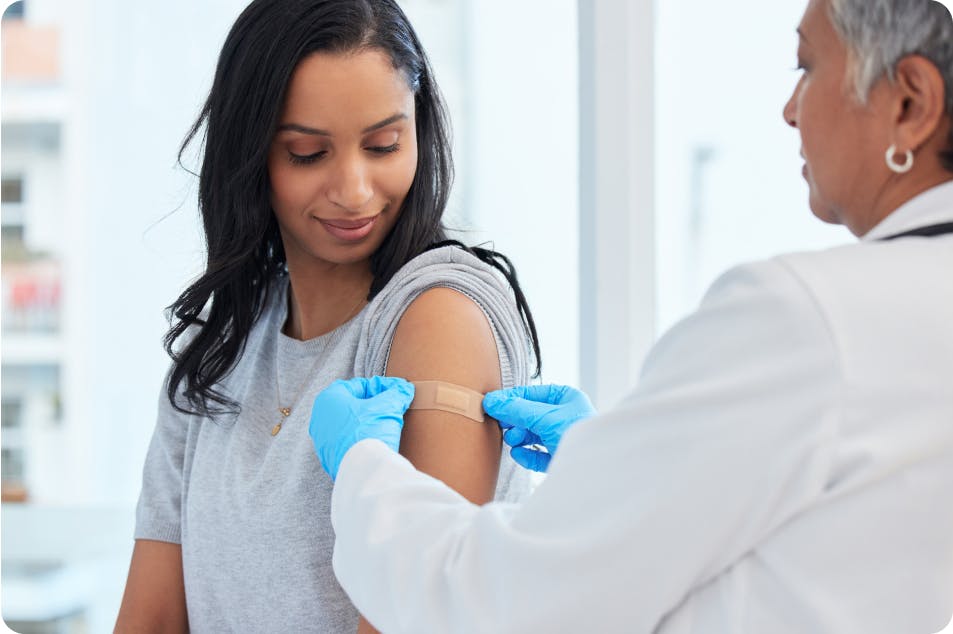 Image: Doctor putting bandage on patient 