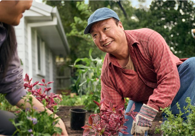 EGPA patient Ken gardening with his wife