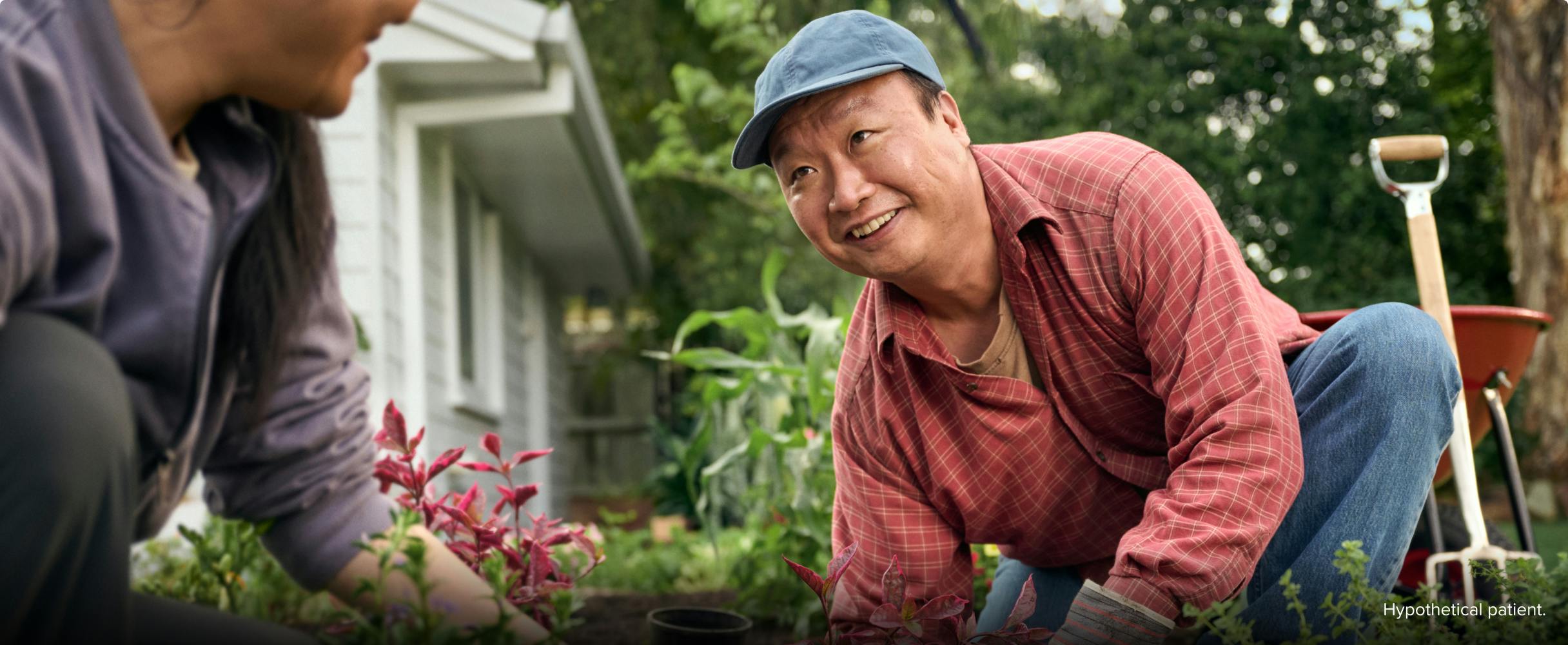 EGPA patient Ken gardening with his wife