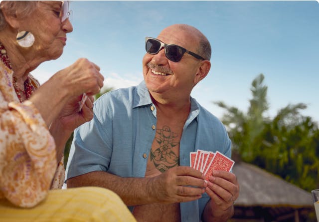 COPD patient Nicholas playing cards with a female friend