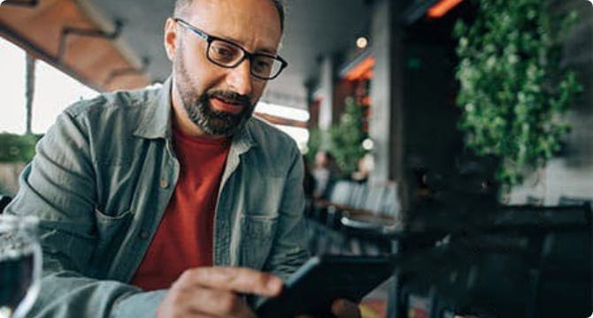 Man looking at tablet