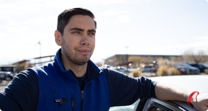 Man leaning on car