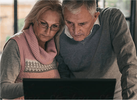 Image of couple researching information about shingles