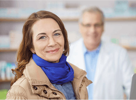 Image of woman smiling at pharmacy