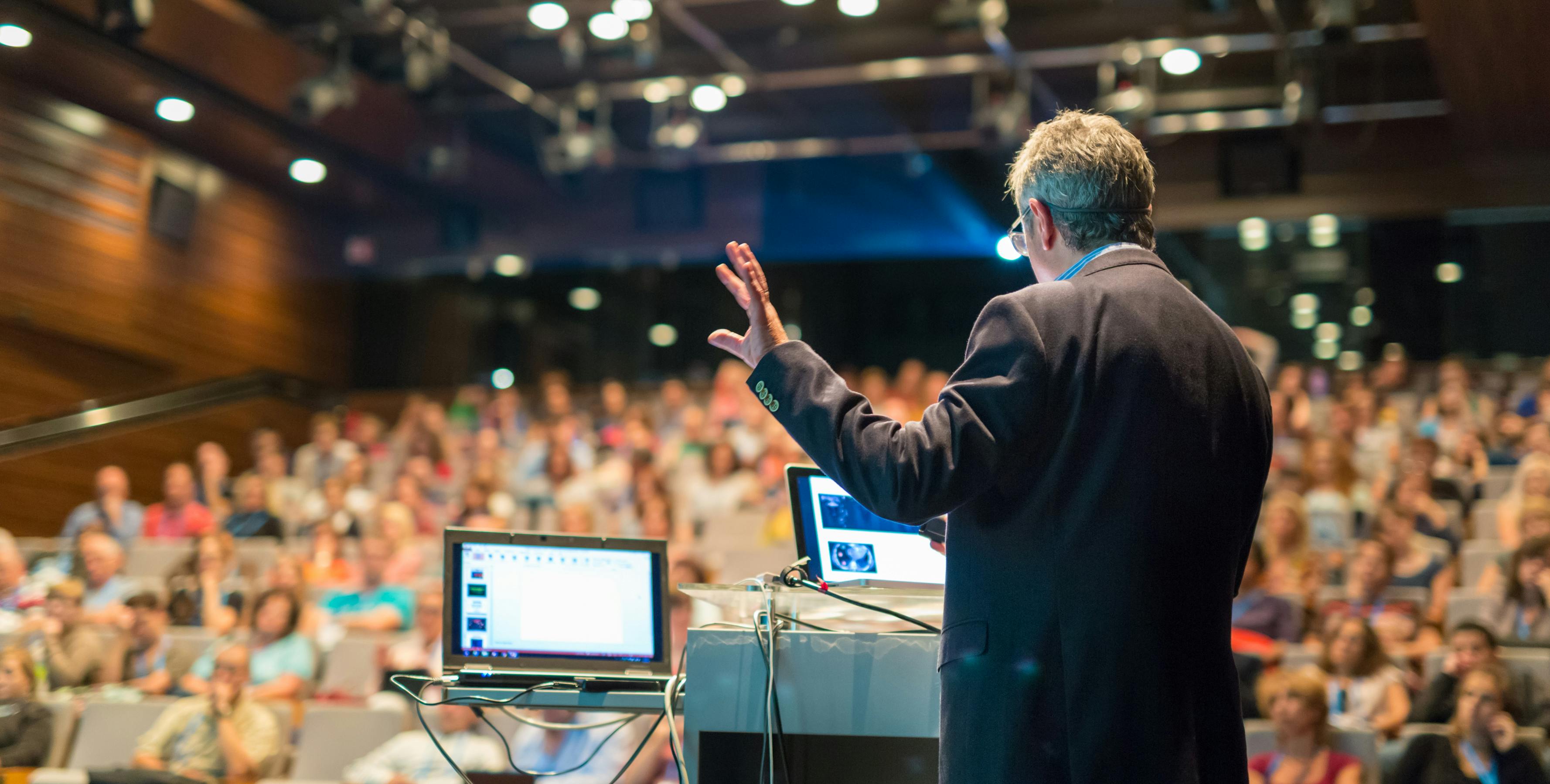 Speaker giving a talk on corporate Business Conference