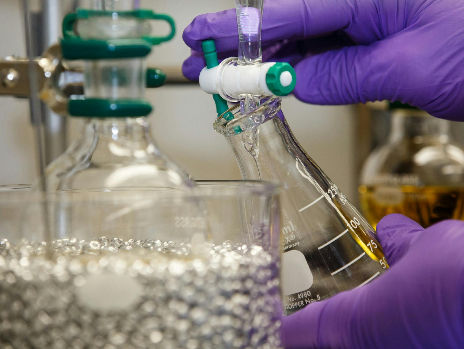 Scientist filling up a medical bottle