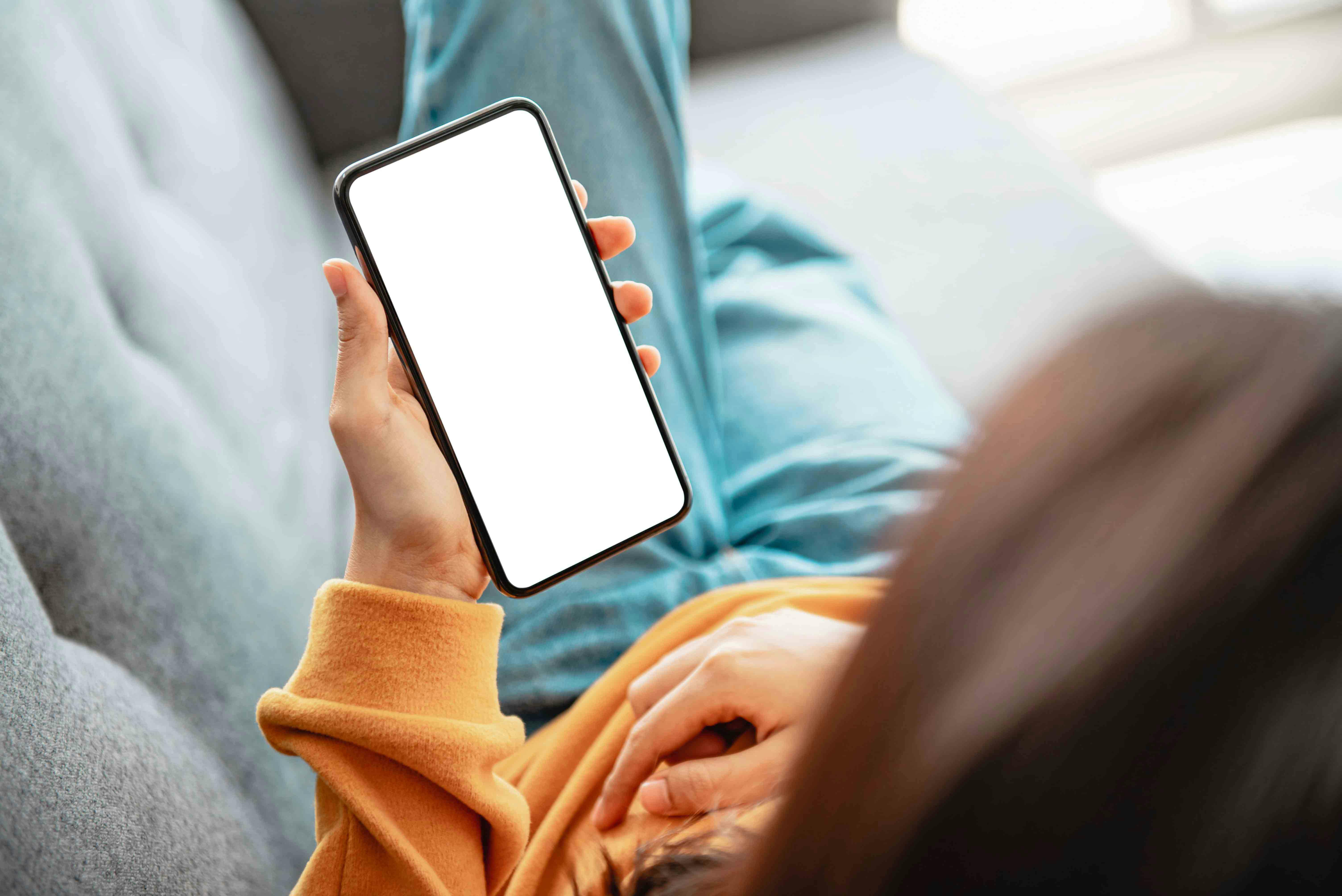 Closeup - Woman using mobile smartphone