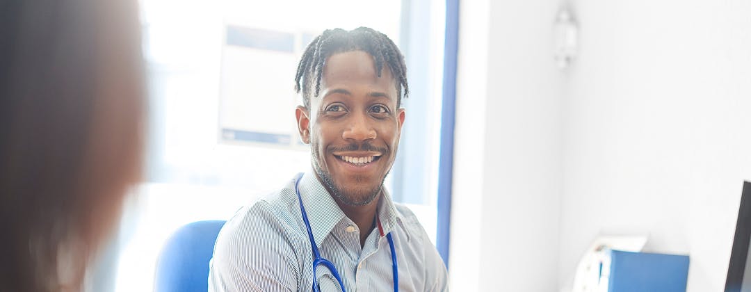 Portrait of a man who is a doctor, sitting in his office