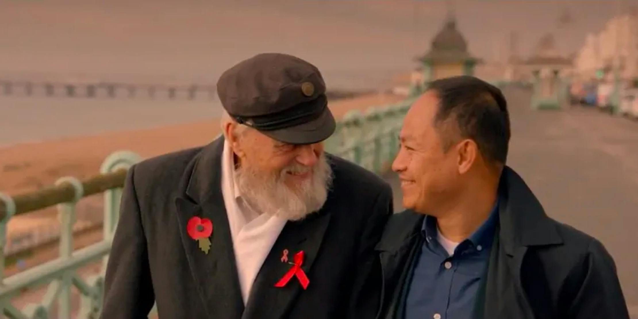 Two men looking at each other and smiling