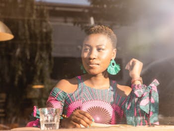 woman at a café looking to the left 