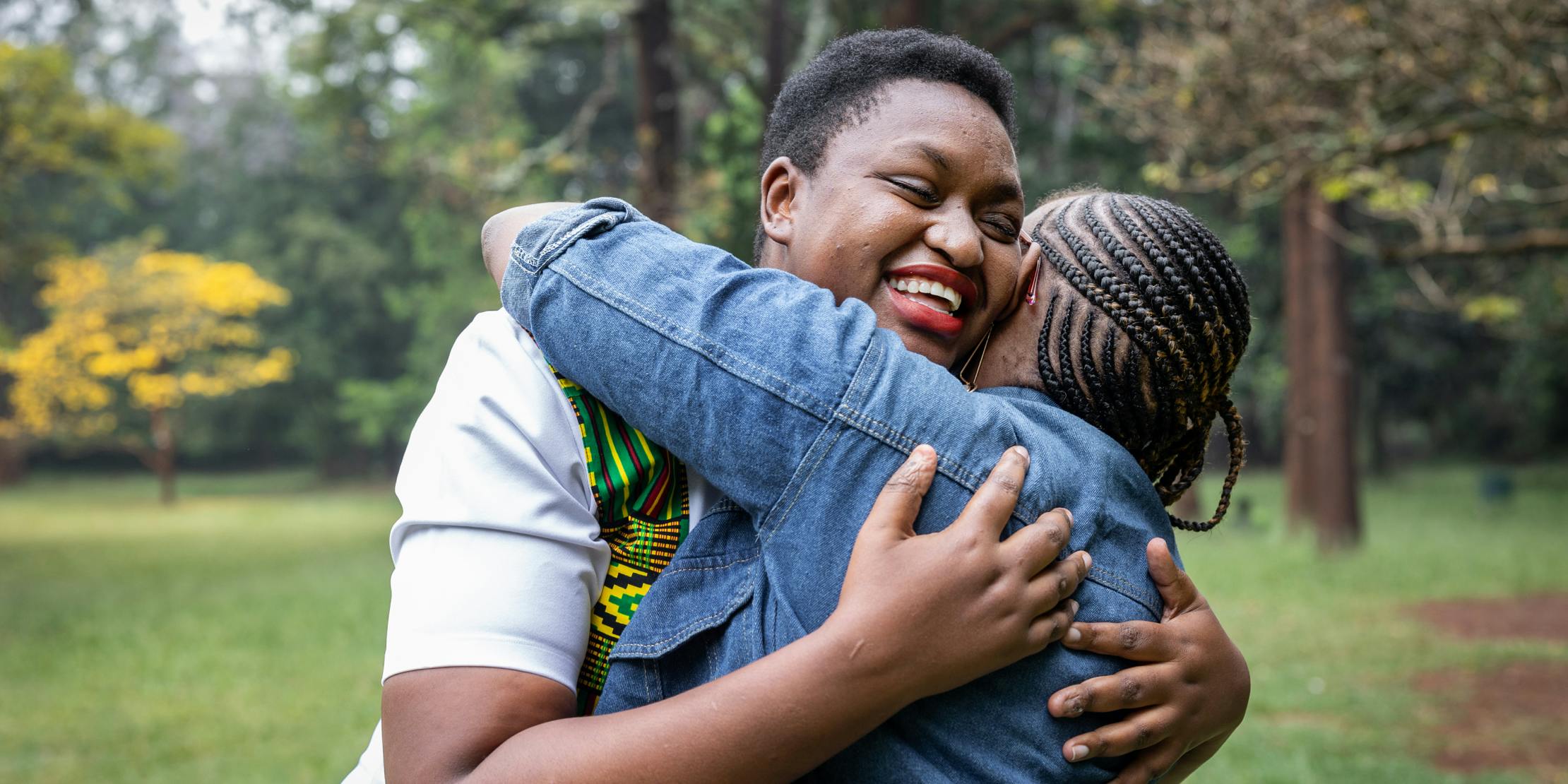 Young woman living with HIV photographed with her friend in Nairobi, Kenya