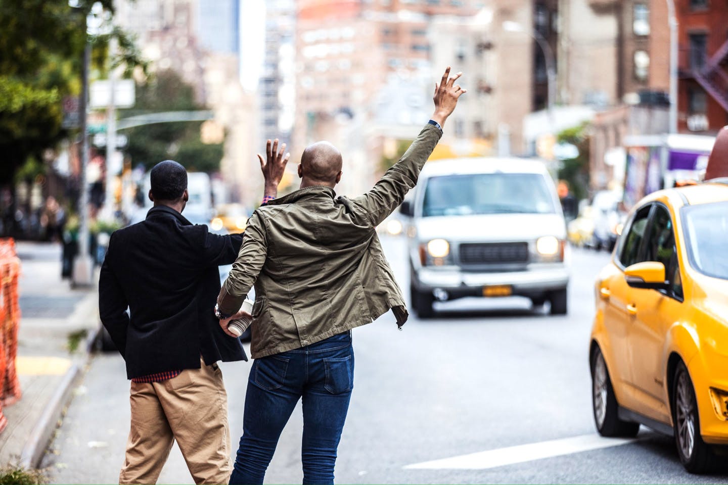 CMI Booklet image two guys hailing cab