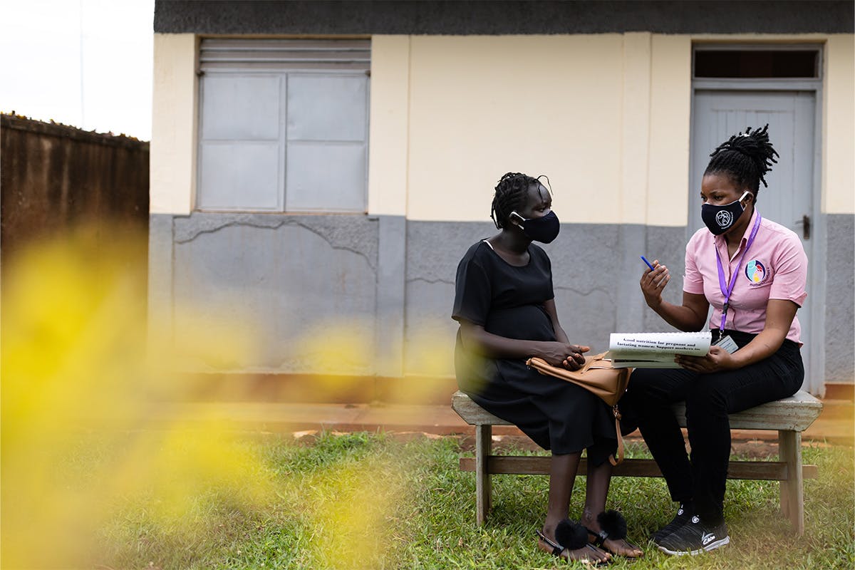 Two people sitting outside