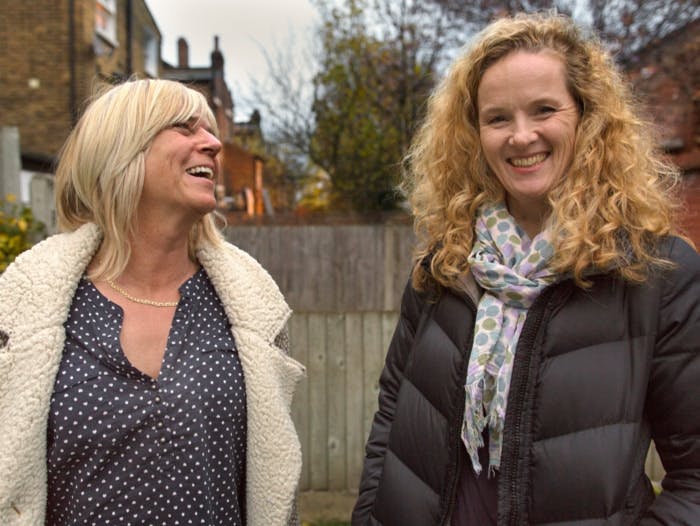 Transgender woman smiling with daughter