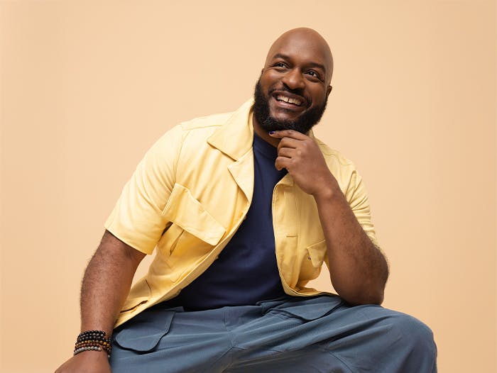 Happy man wearing a yellow shirt